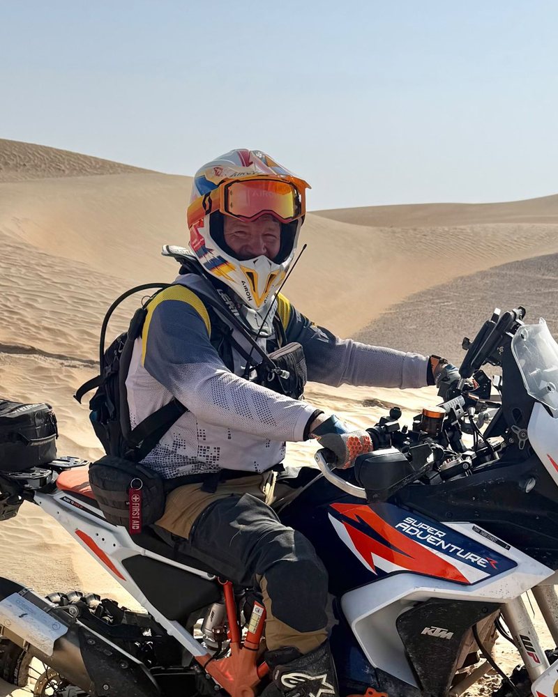 Thom on his KTM 1290 Super Adventure, sunk to the axles in the dunes